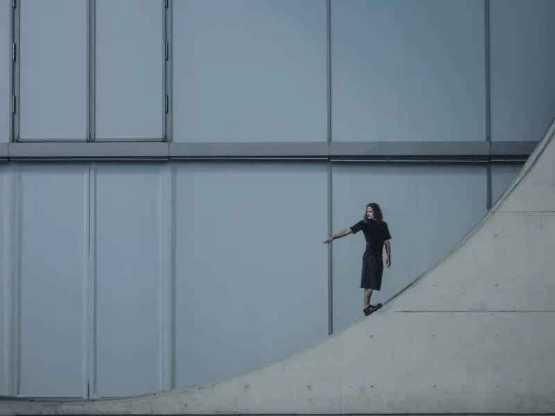 Man on geometric wall