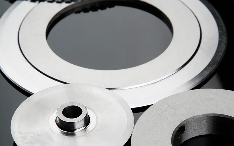 Set of polished circular machine knives with smooth edges, showcasing Durham Duplex's precision manufacturing for high-quality knives.