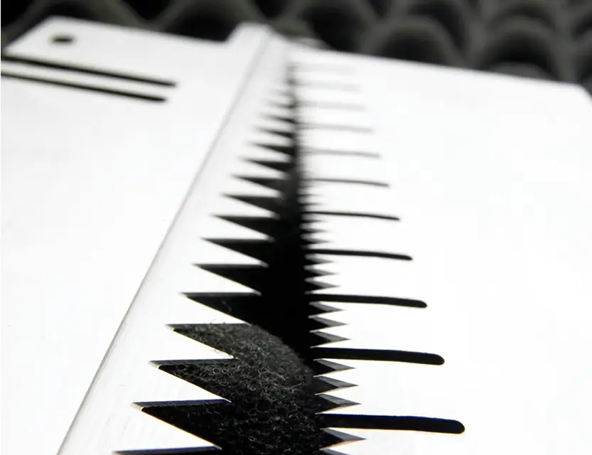 Close-up of a blade with sharp triangular teeth, demonstrating Durham Duplex's expertise in precision cutting tools.