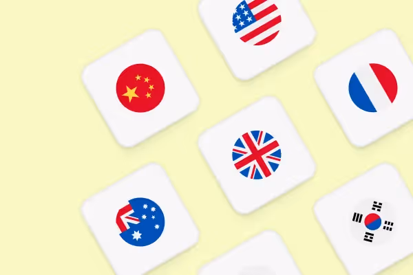 Tiles displaying circular flag icons of China, United States, France, United Kingdom, Australia, and South Korea on a pale yellow background.