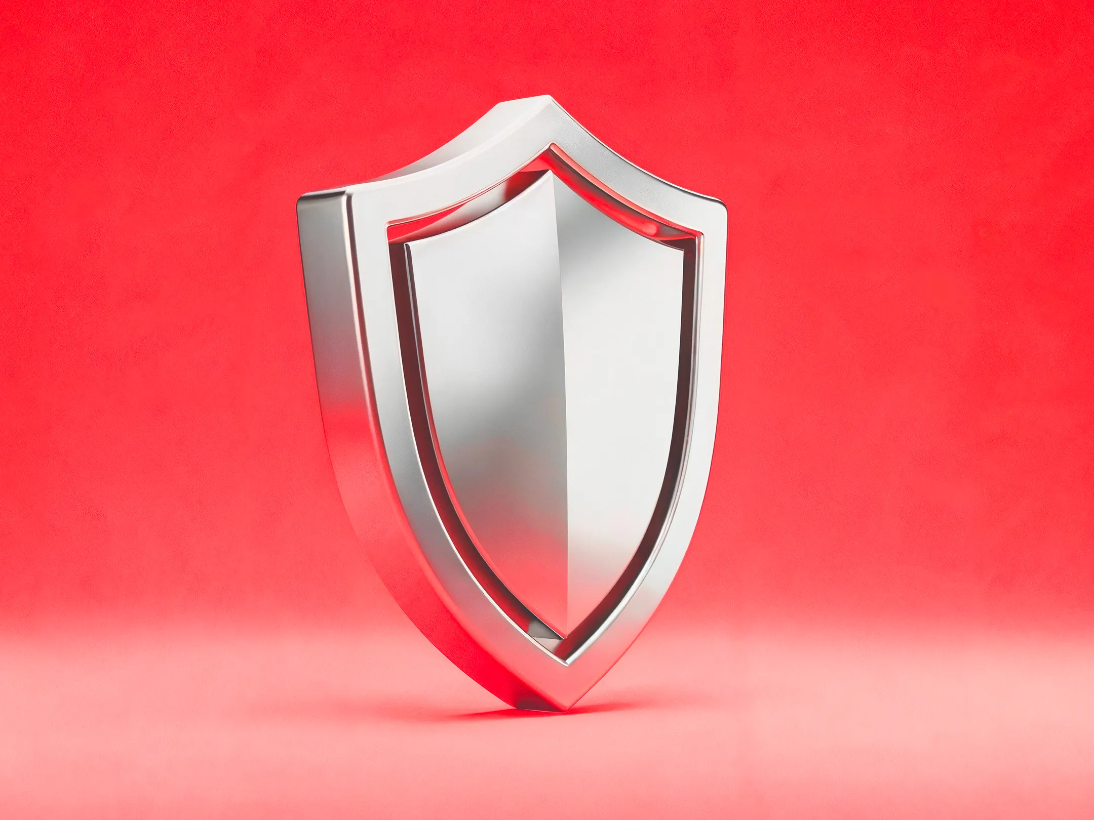 درع معدني يرمز إلى كيفية حماية المتداولين لرأس المال عبر موازنة فعالة بين المخاطر والمكافأة ضمن استراتيجيتهم التداولية.