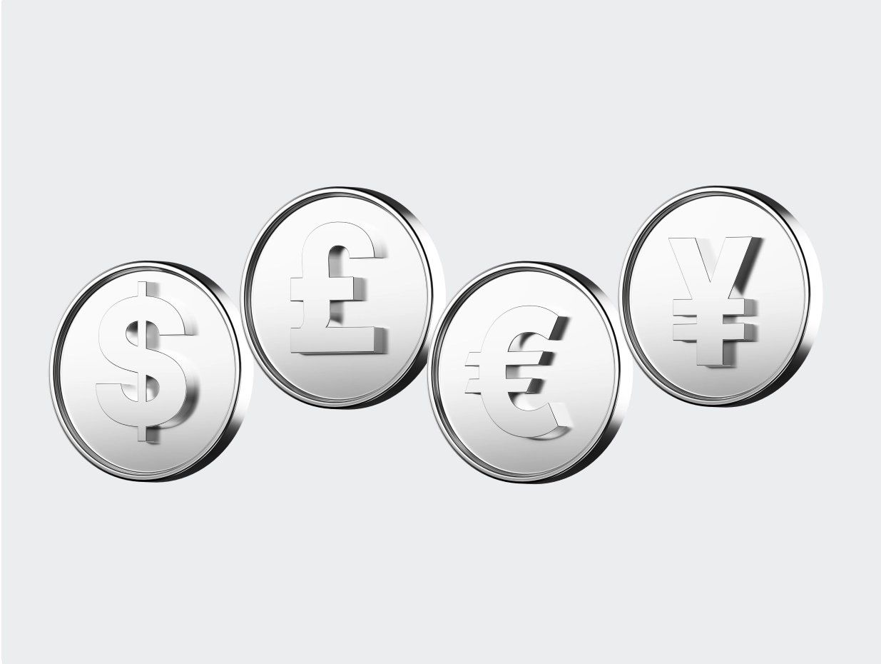 Four silver coins, each with a different major currency symbol: US dollar ($), British pound (£), Euro (€), and Japanese yen (¥), displayed on a light grey background.