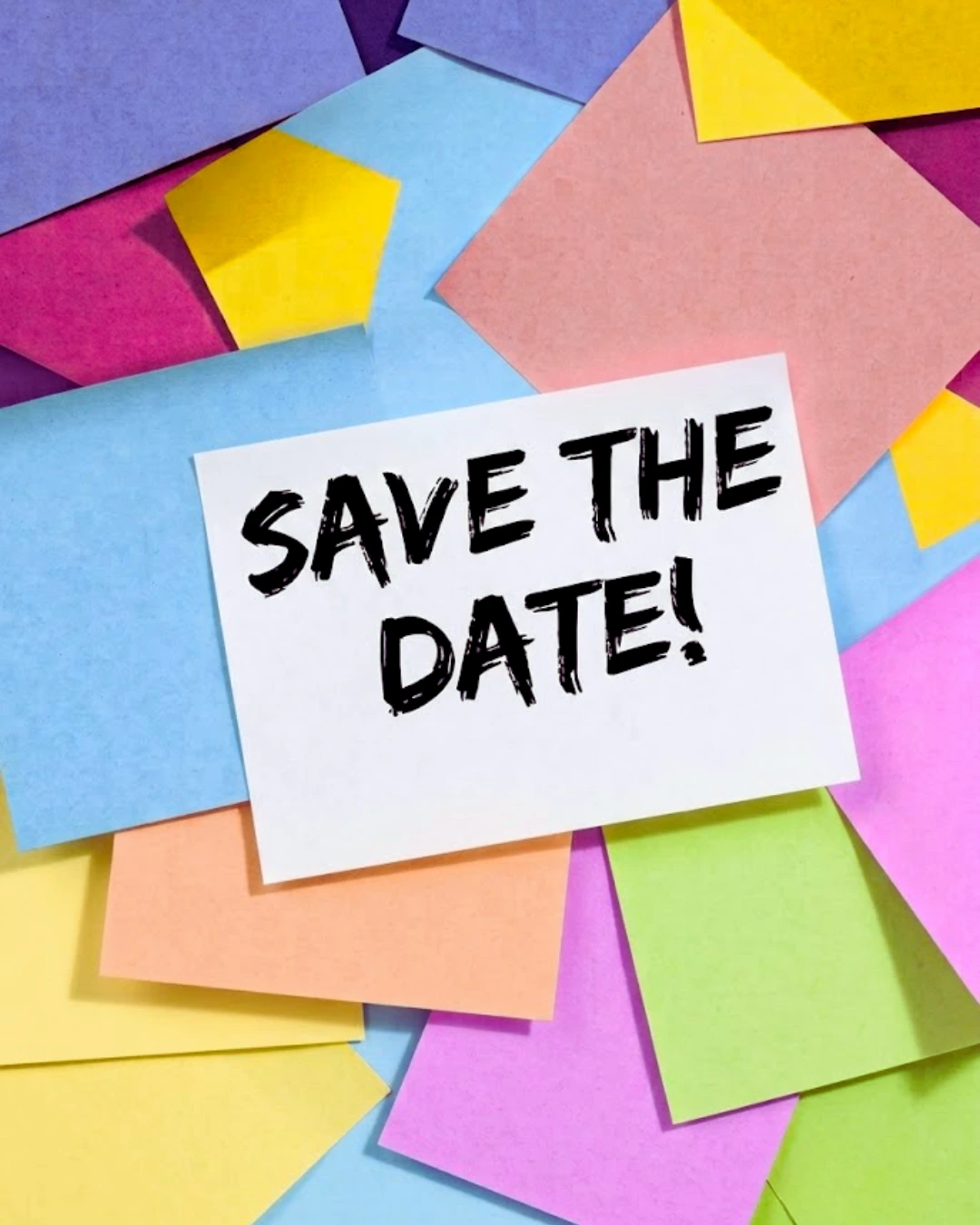 White card with bold text 'SAVE THE DATE!' among scattered colorful paper notes.