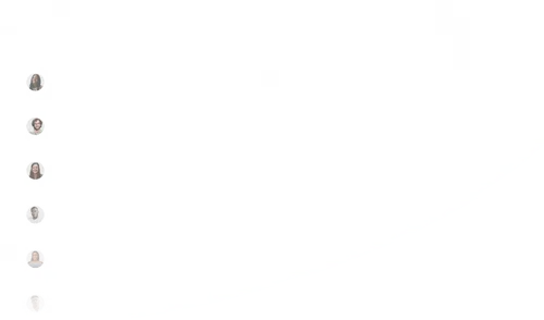 A group of people walking up a hill.