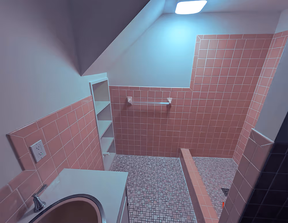 A bathroom featuring a sink and a toilet, showcasing a clean and functional design.