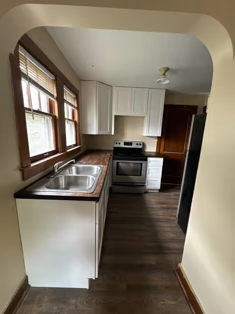 A kitchen featuring a washer and dryer, showcasing a blend of cooking and laundry facilities in one space.