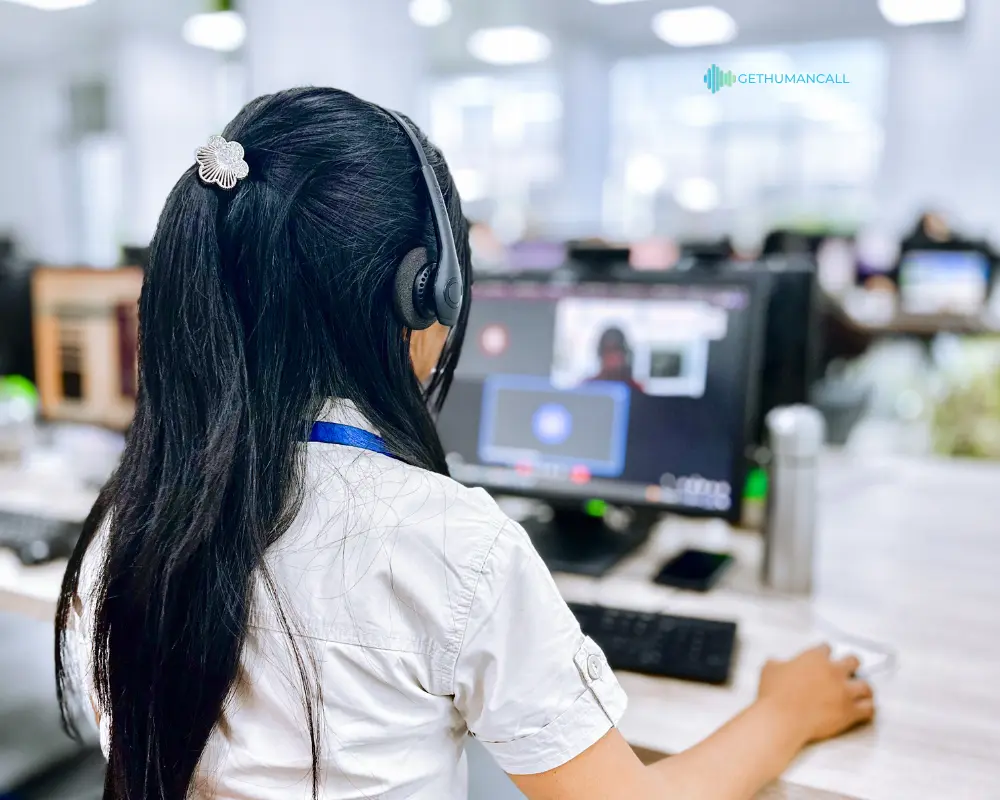 Customer care agent in front of her PC