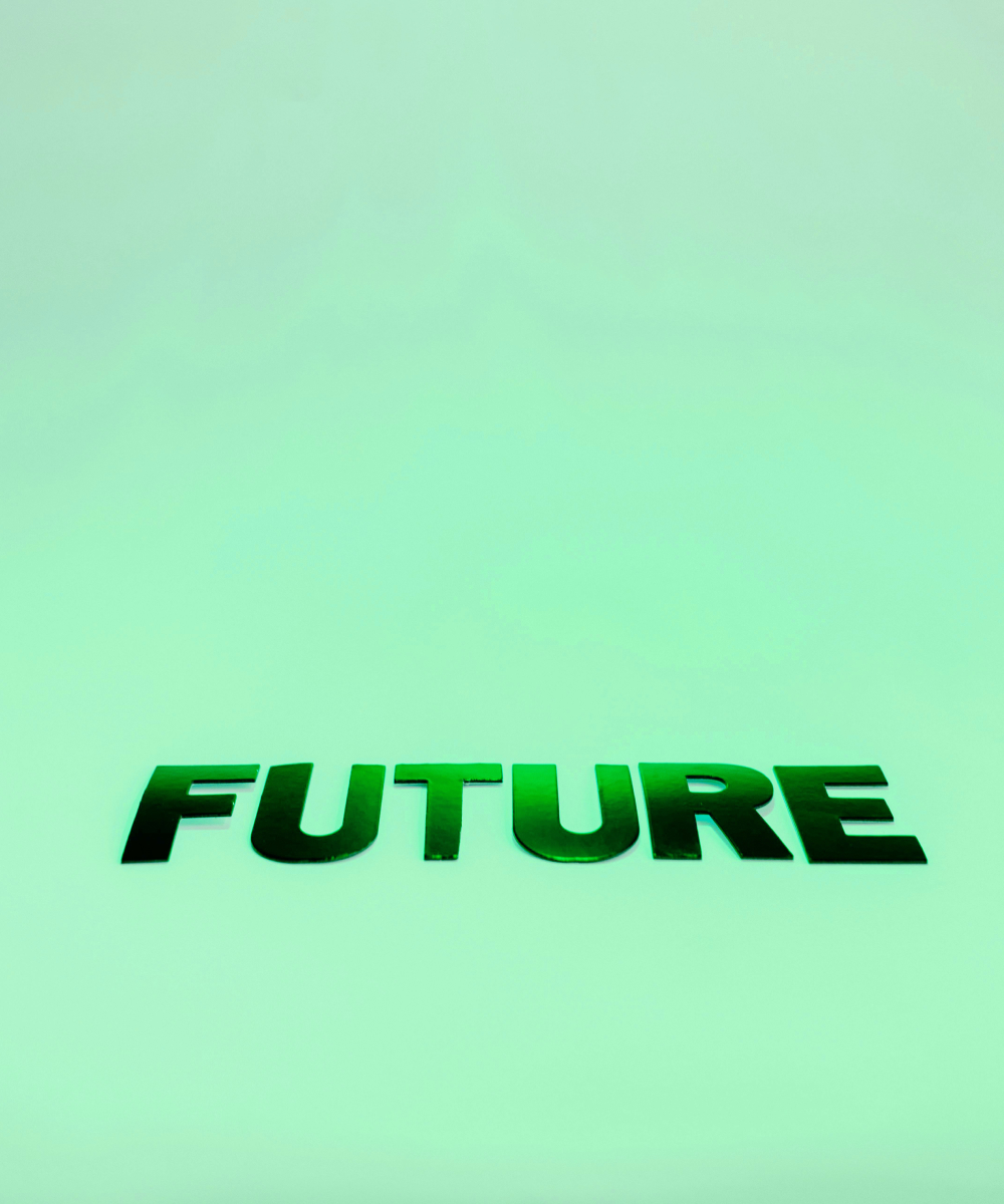 Green gradient background with bold word FUTURE symbolising forward-thinking and actionable outcomes from Turn Heads Global consultations.