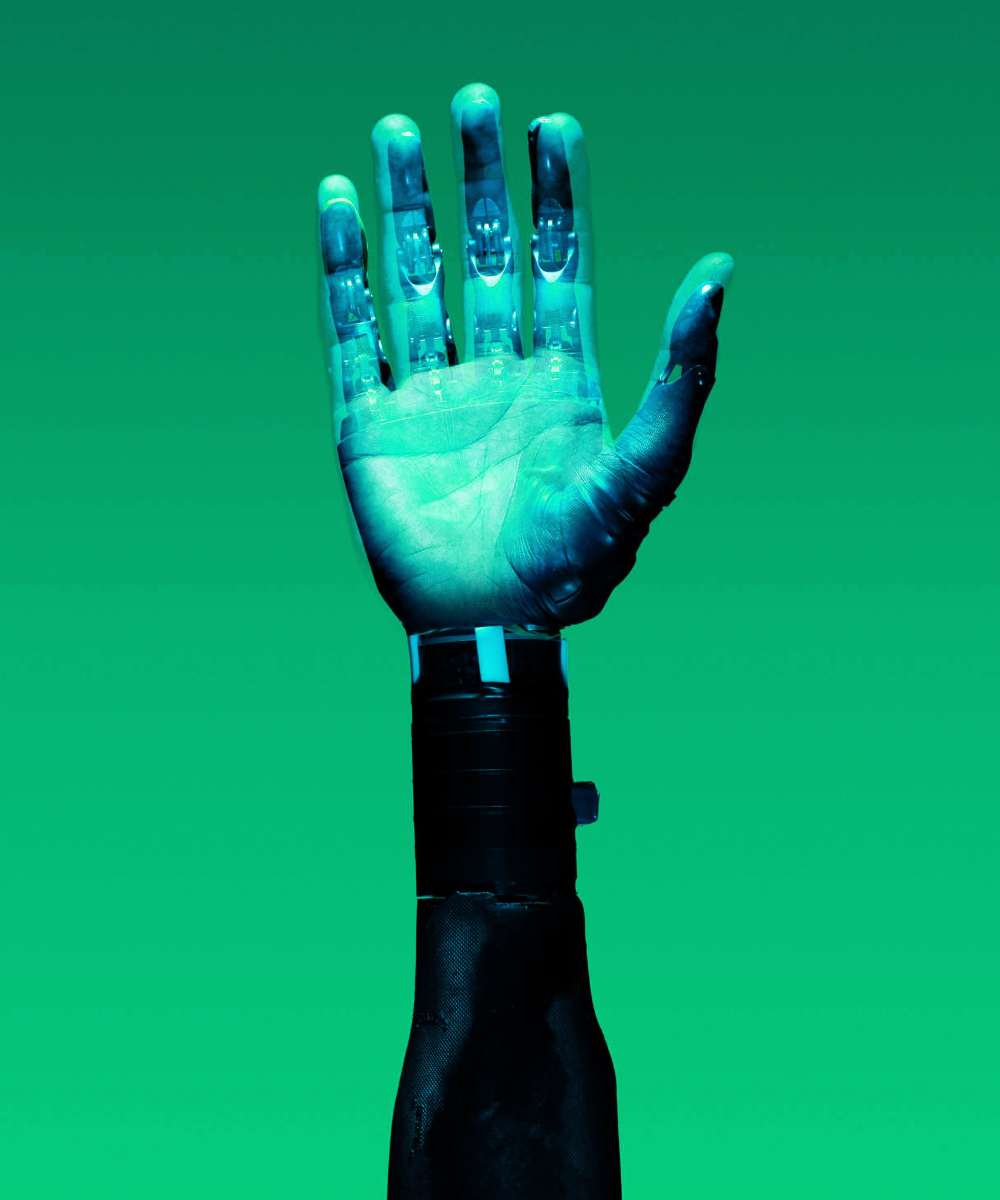 Artificial hand under green light symbolising innovation, technology, and future readiness in Turn Heads Global career growth journey.