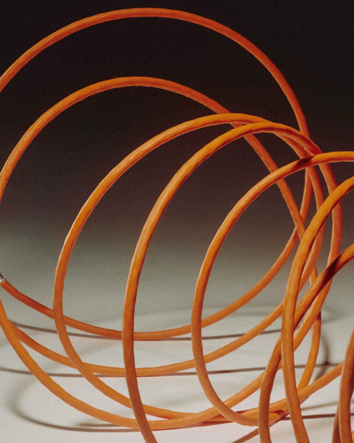 A bunch of orange wires in a spiral shape.