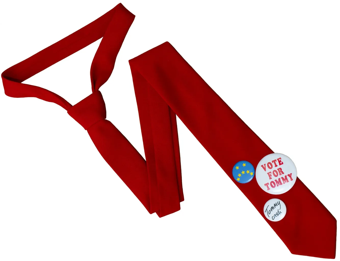 A Tie With Pins Saying “Vote For Tommy” and “Tommy Cash”