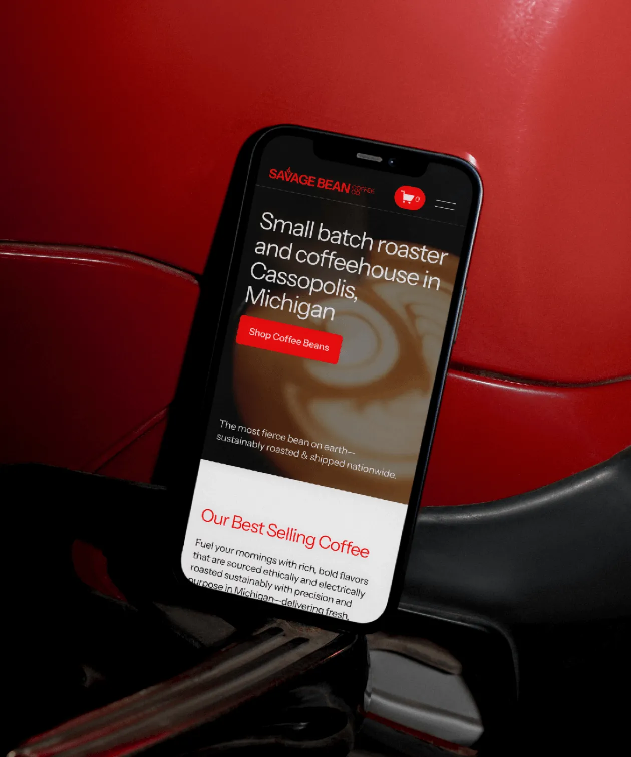 Homepage of Savage Bean Coffee Co website in front of red background