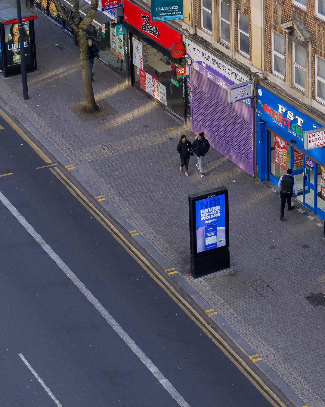 Aspora app UI featured in OOH campaign creative by Noise Media Group