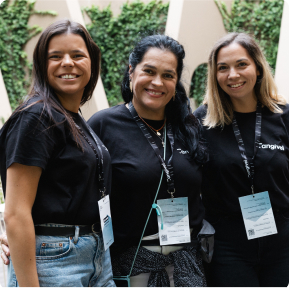 Three hyphen colleagues hugging at the event