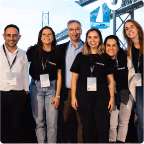 Six hyphen colleagues taking a picture at an event
