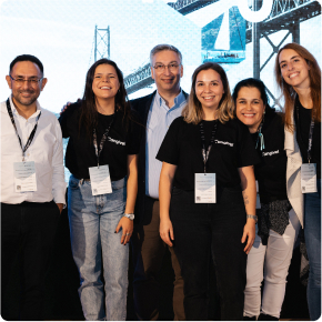 Six hyphen colleagues taking a picture at an event