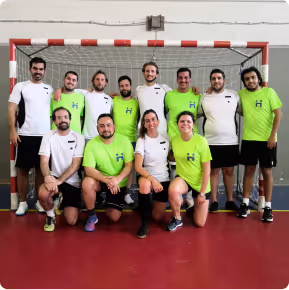 Hyphen colleagues playing football