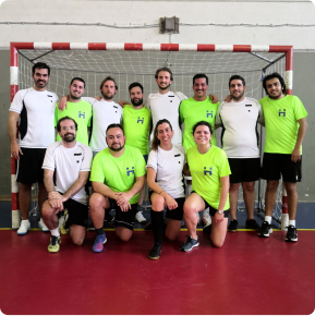 Hyphen colleagues playing football