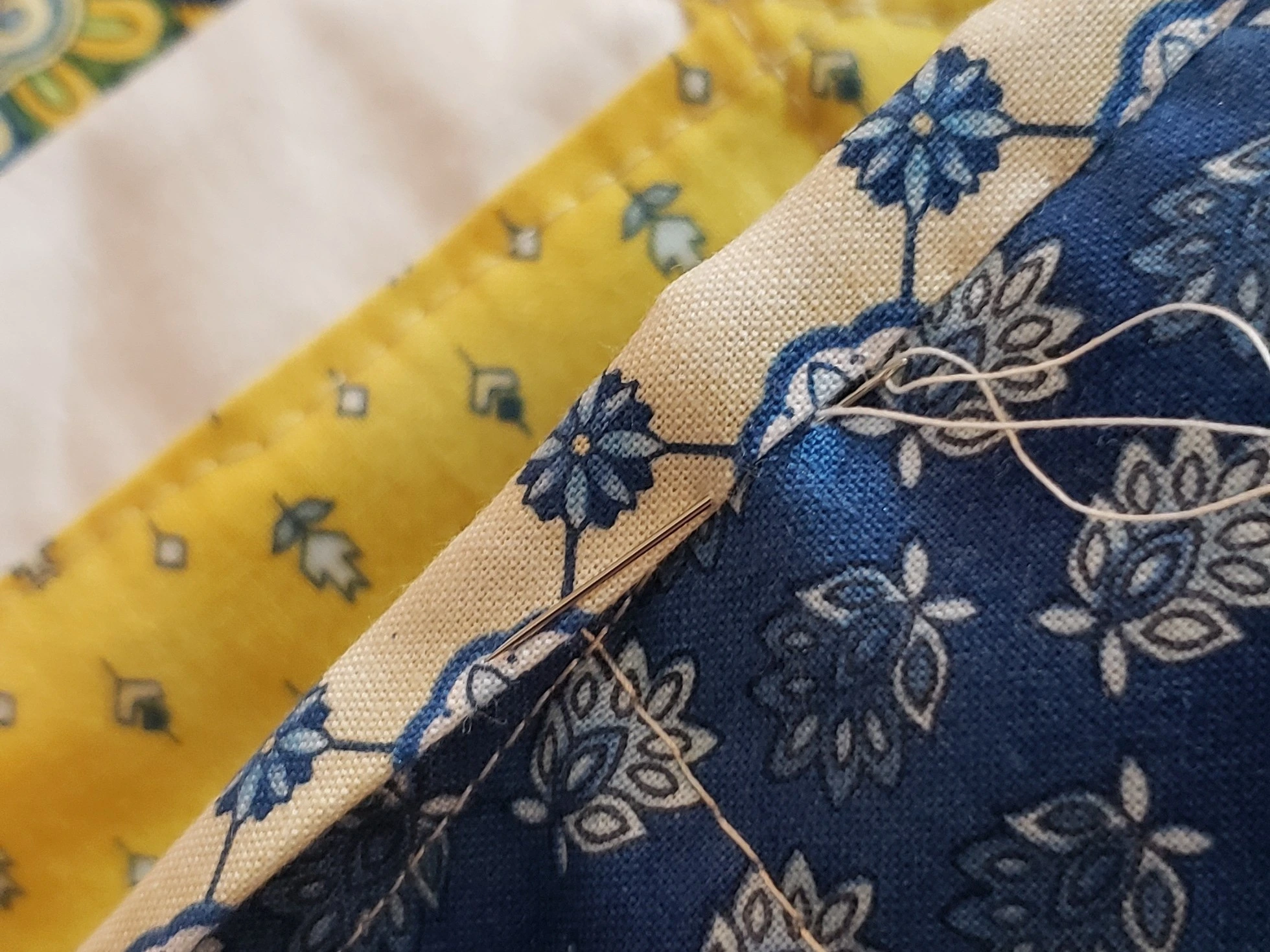 Close up of a binding, needle and thread