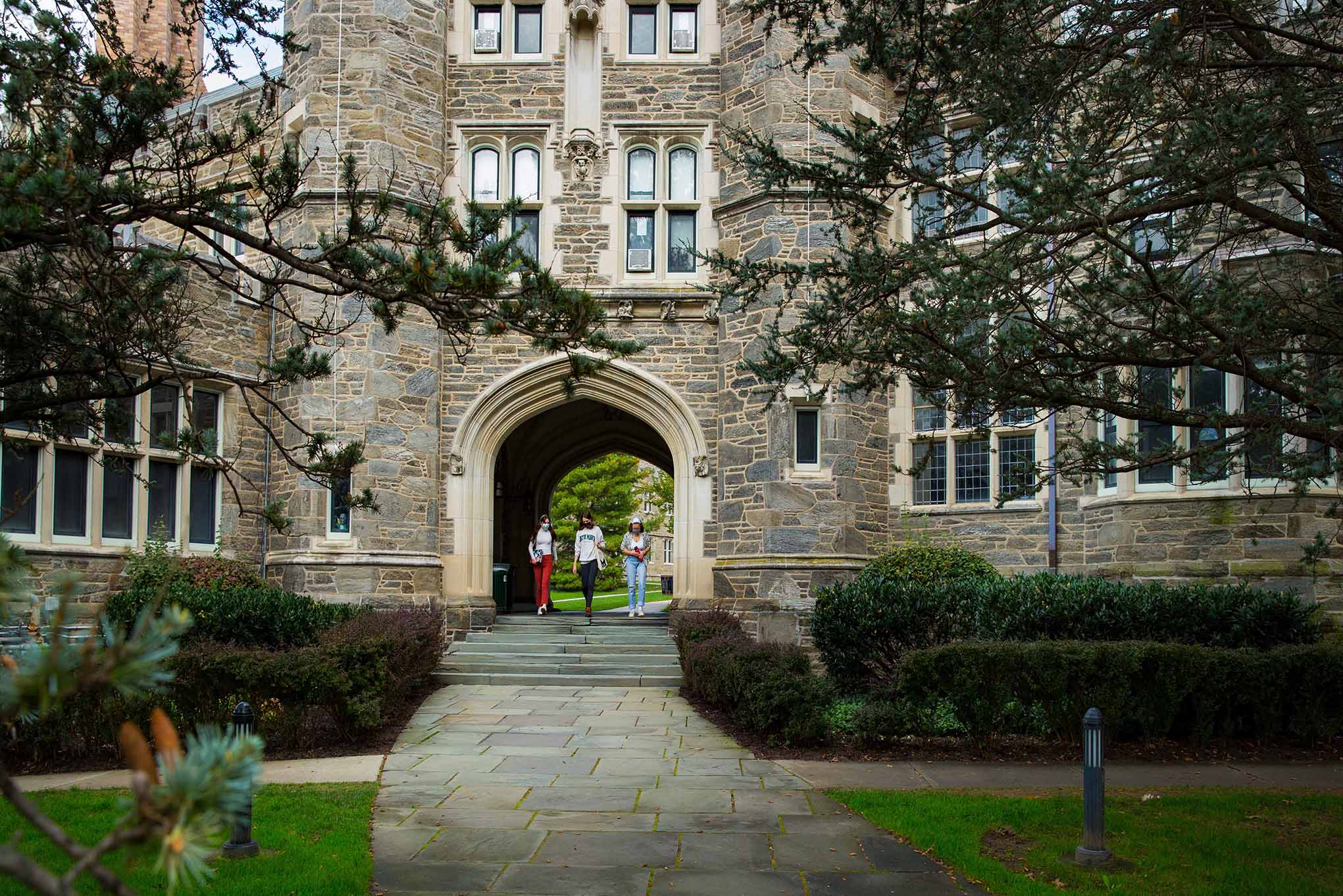 An image of a Bryn Mawr building's gate during the fall time