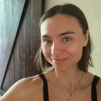 Cute girl smiling at camera giving a testimonial about working with healing within.