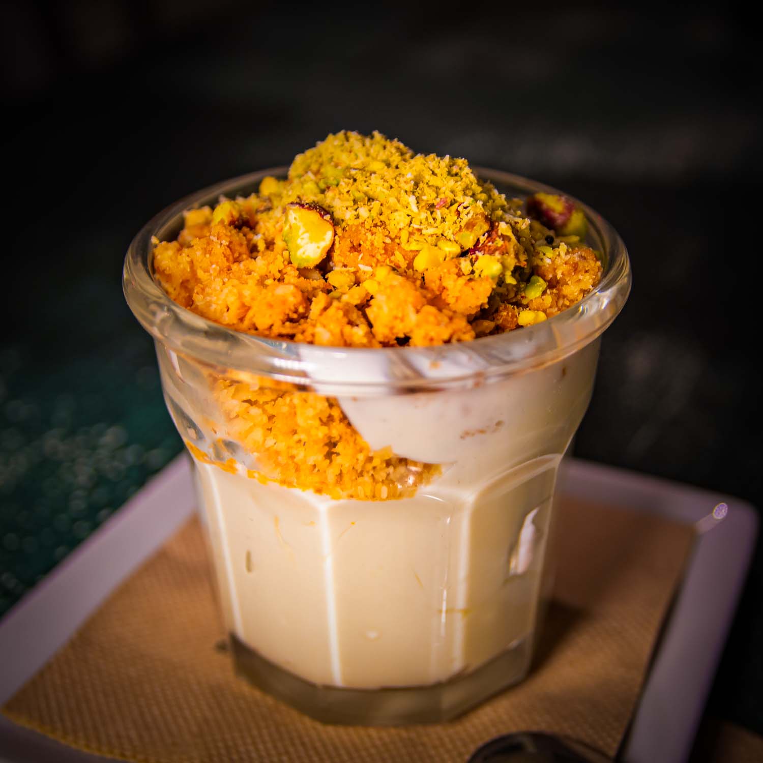 Slice of Koku Lime Pie with creamy lime filling on a crumbly biscuit base, a light and tangy dessert