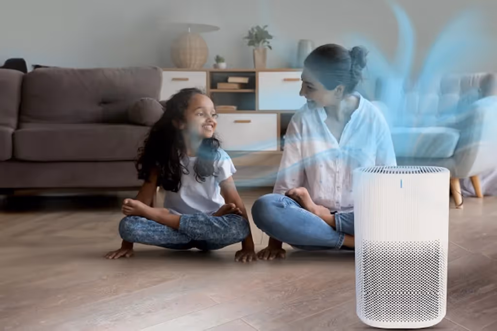 A mother and child near an air purifier.