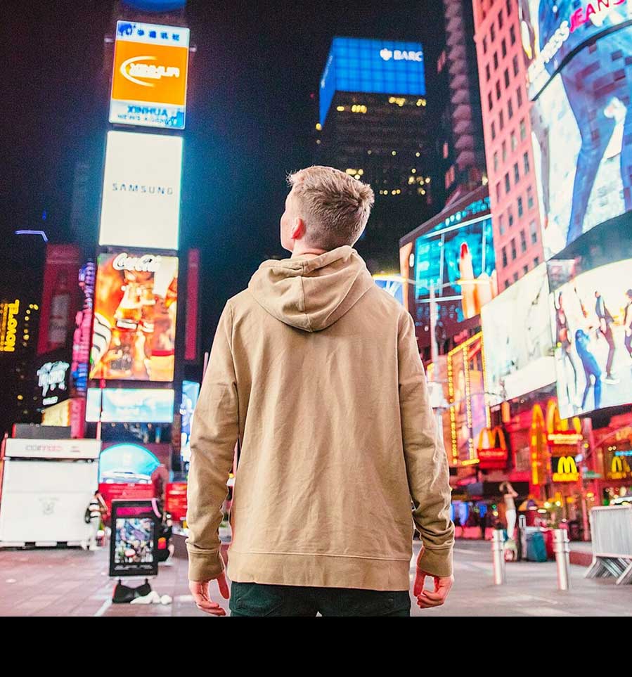 boy student in time square at night