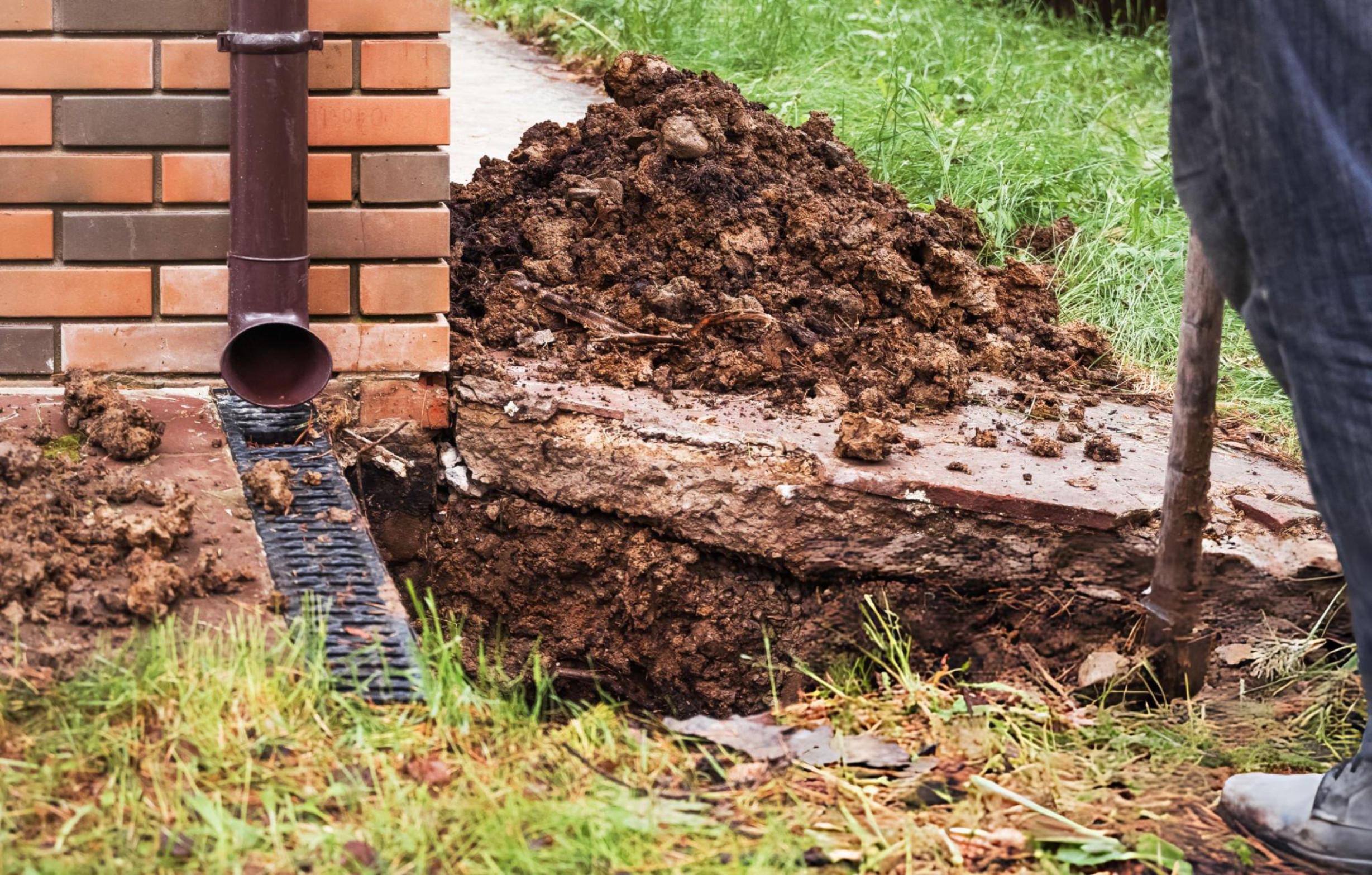 Stormwater drainage system installation in DFW to control runoff and prevent yard flooding