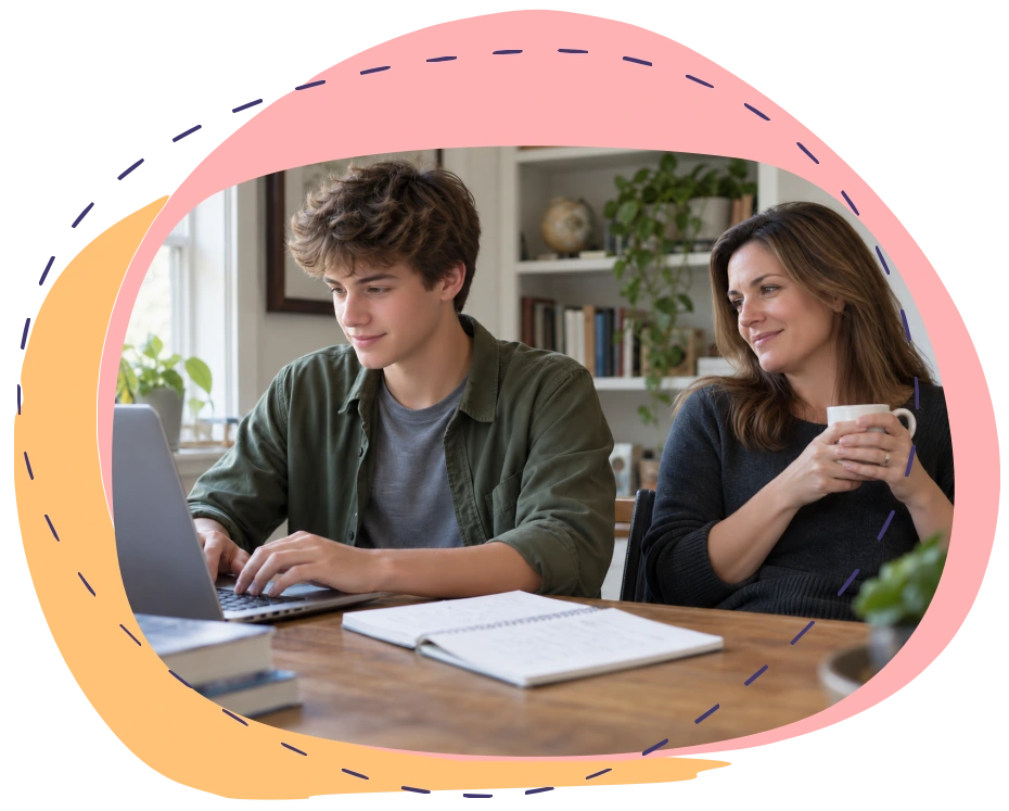 A high-school student working at a laptop while his mother looks on