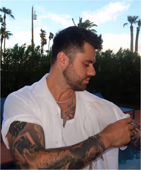 Mack Falcon, wearing a white shirt