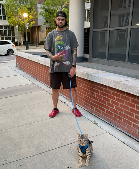 Mack Falcon with his Cat. Walking His Cat
