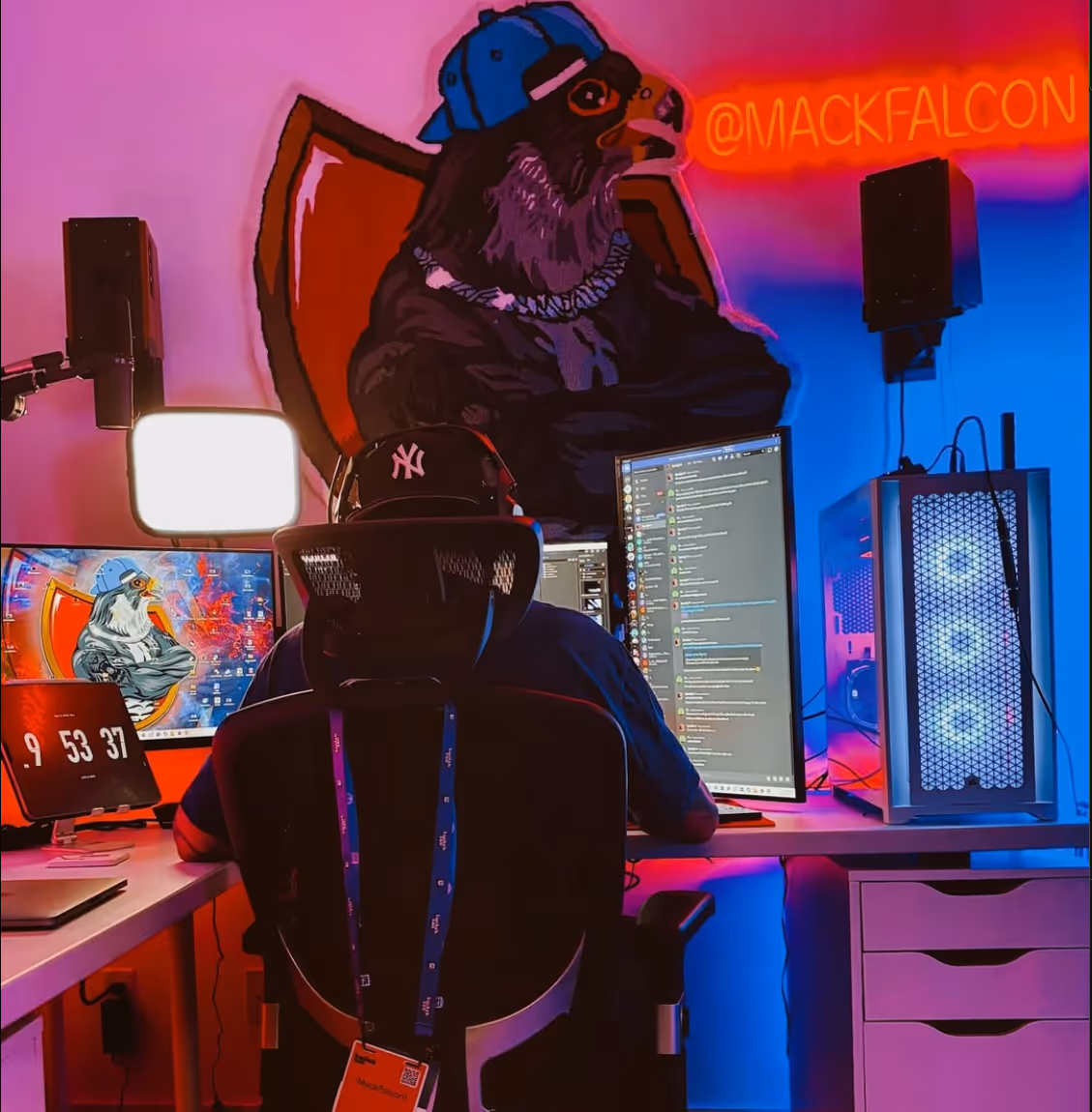 Mack Falcon sitting at a computer working on his videos