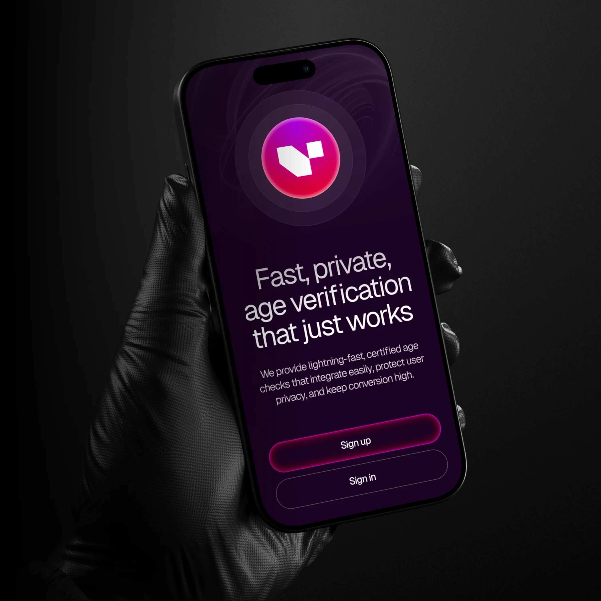 Hand wearing a black glove holding a smartphone displaying an app for fast, private age verification with sign up and sign in buttons on a dark purple screen.