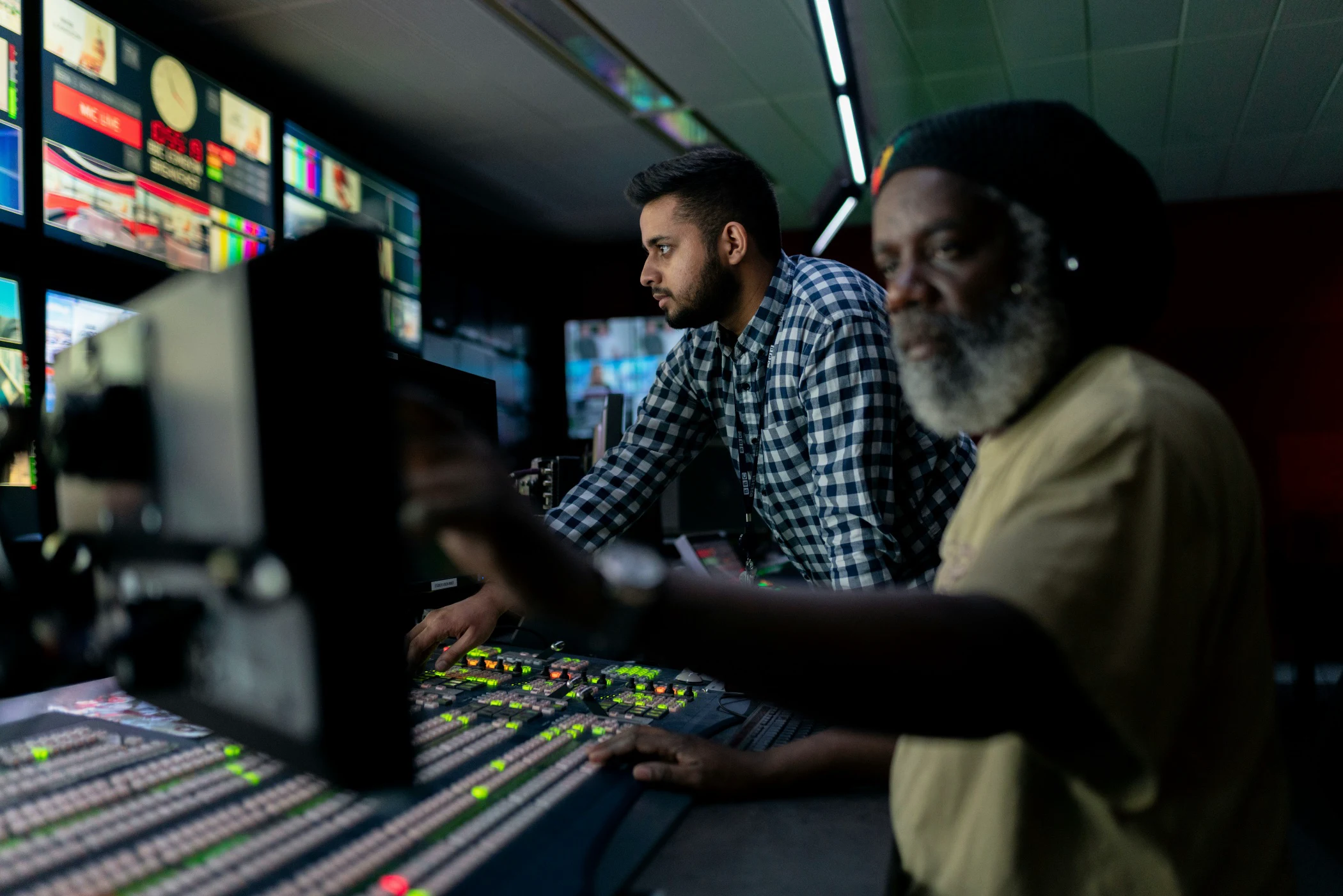 Engineers operating systems in a technology control room