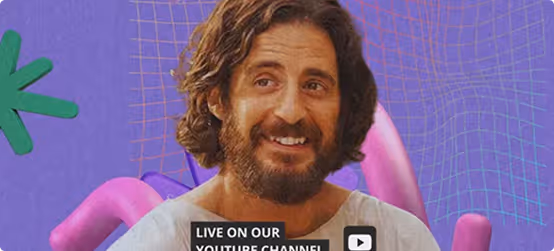 Smiling bearded man with curly hair in front of a purple background with abstract shapes.