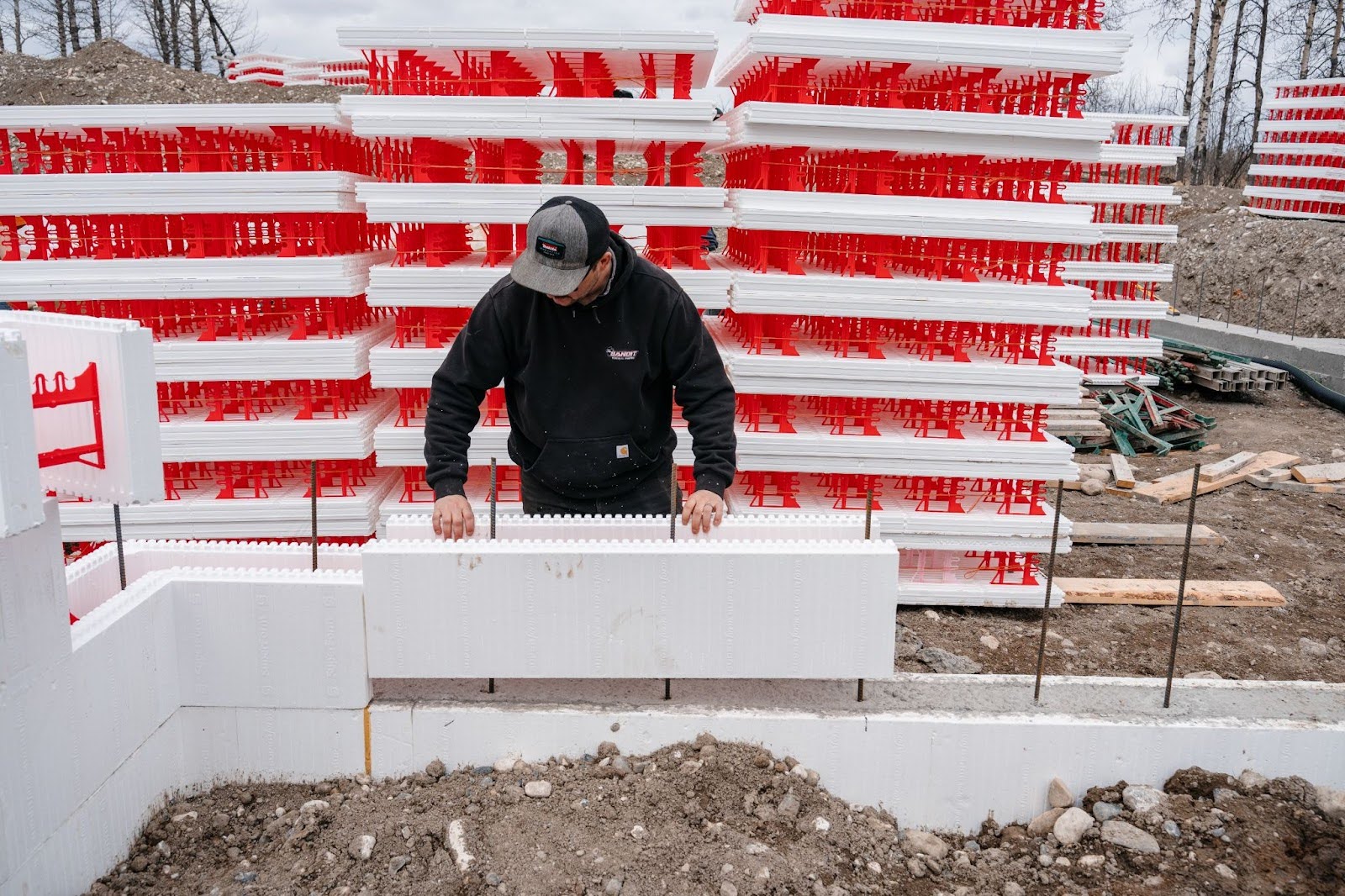 An expert is installing SuperForm ICFs on a job site.