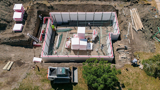 This image depicts SuperForm ICF blocks being installed on a project. 
