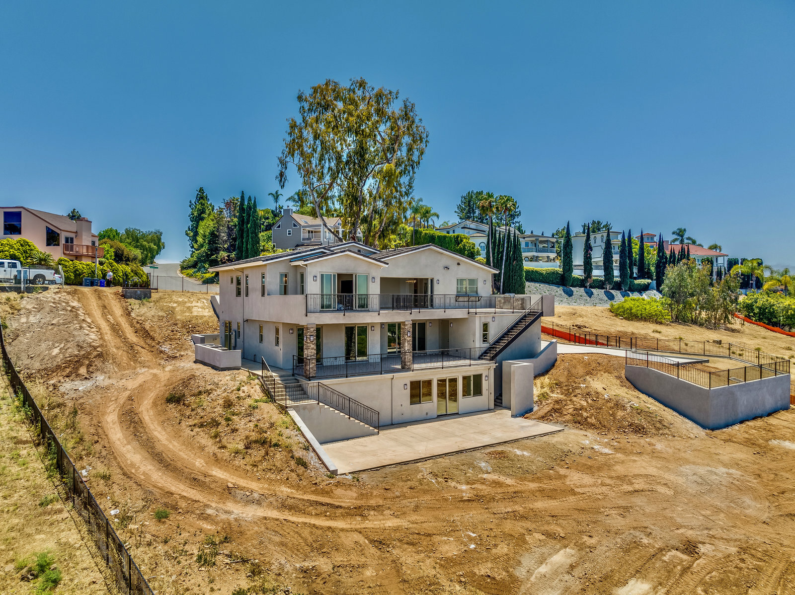This image shows a three-story home on a hill made from ICF construction.