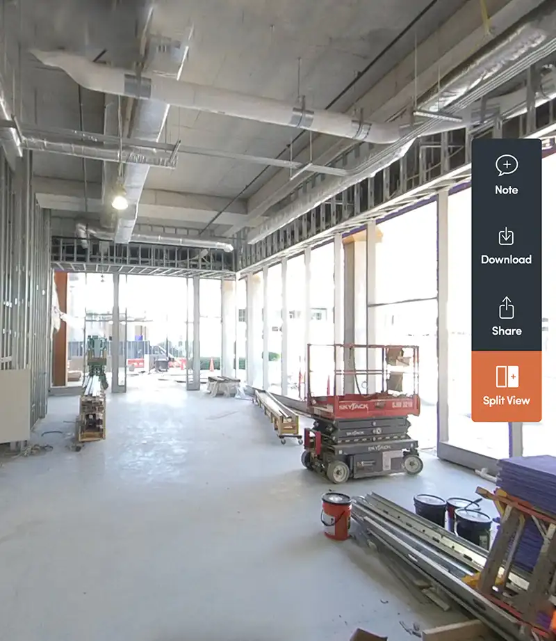 Inside the FNB Tower Lobby with construction vehicles and materials around the room