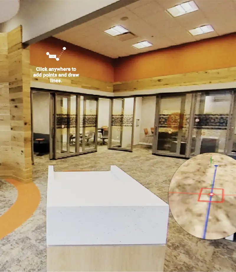 An indoor view of a brown office space with labels on some areas