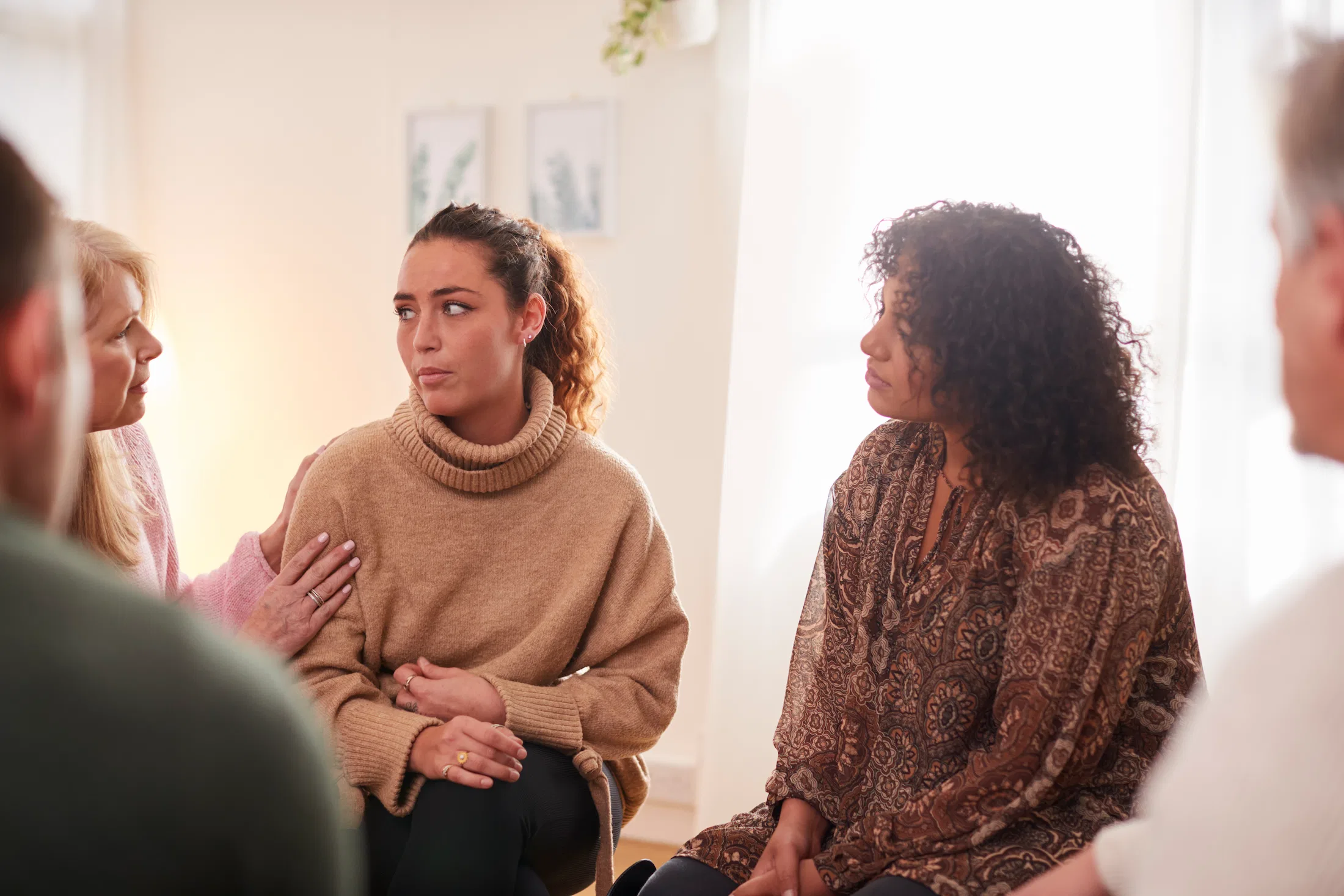 group of people listening in counselling