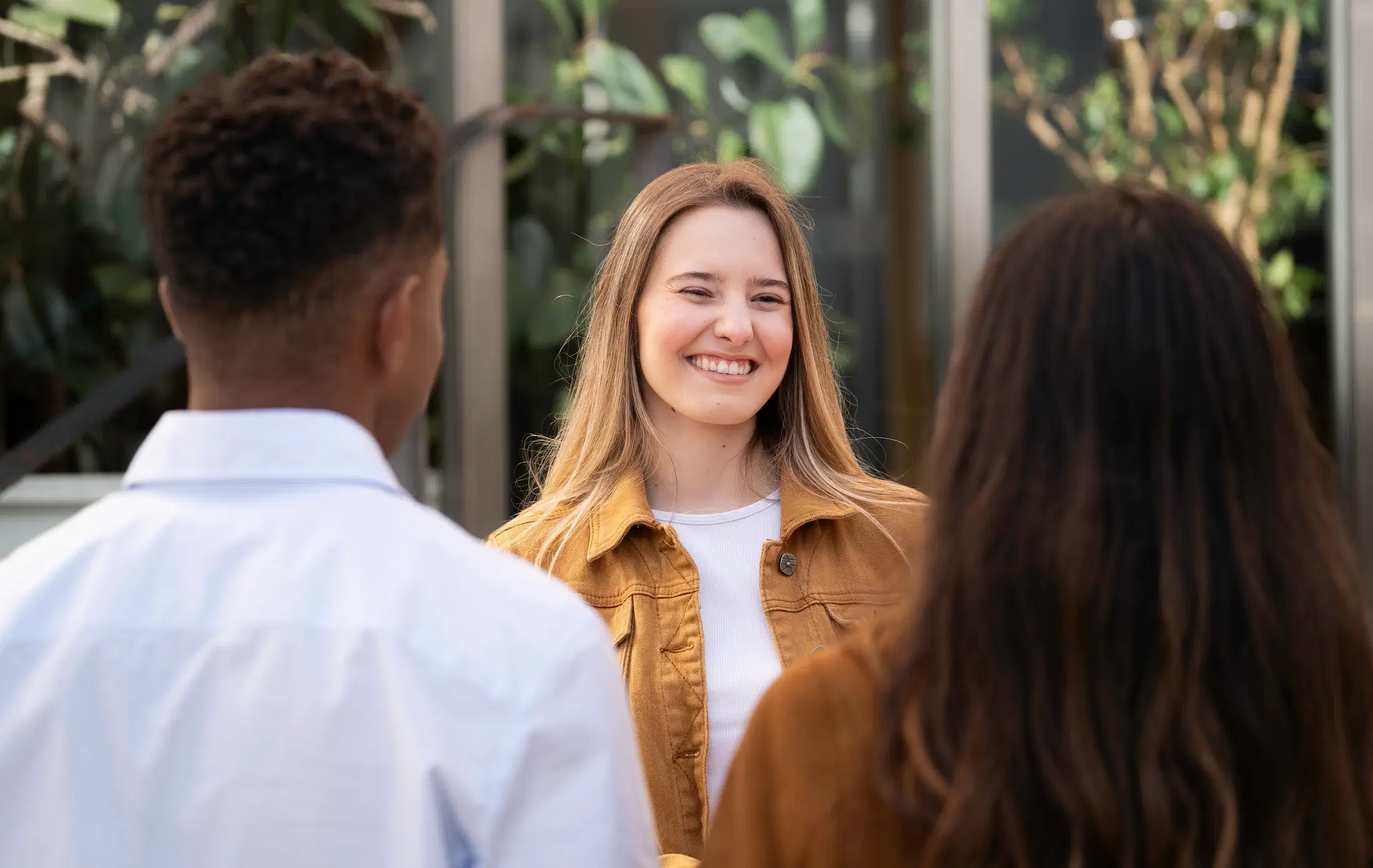 smiling woman with peers and coworkers