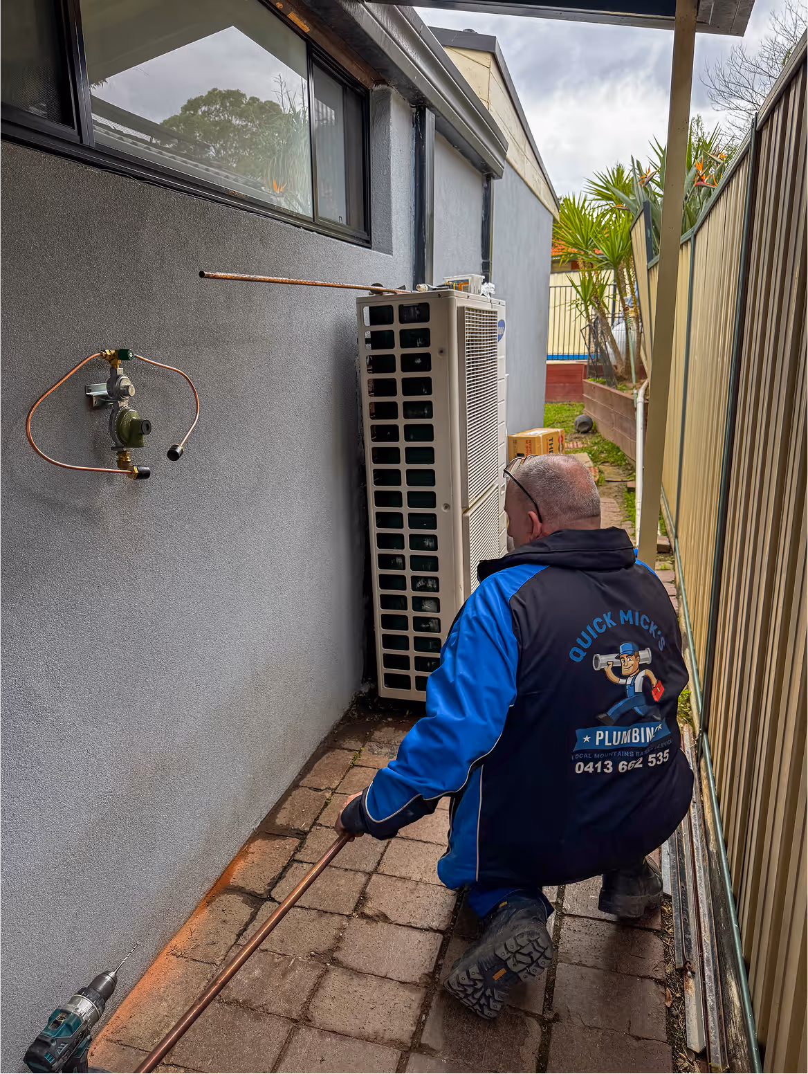 Mick for quick mick’s plumbing bending copper pipe ready for a new hot water installation at a home in the blue mountains nsw