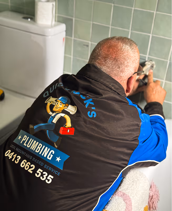 Mick installing new toilet at home in springwood nsw