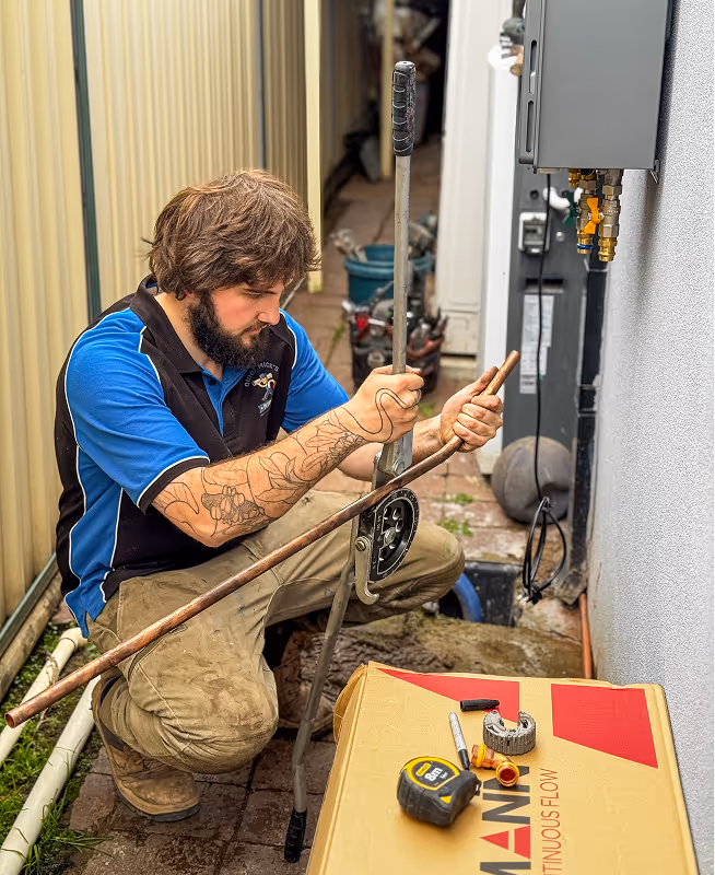 Matt servicing a toilet in st mary's