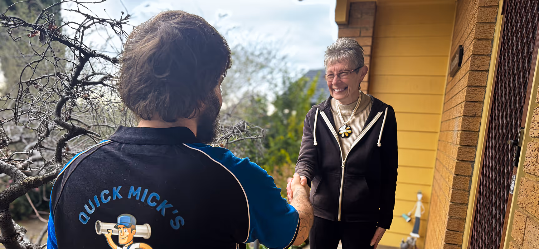 matt shaking happy clients hand