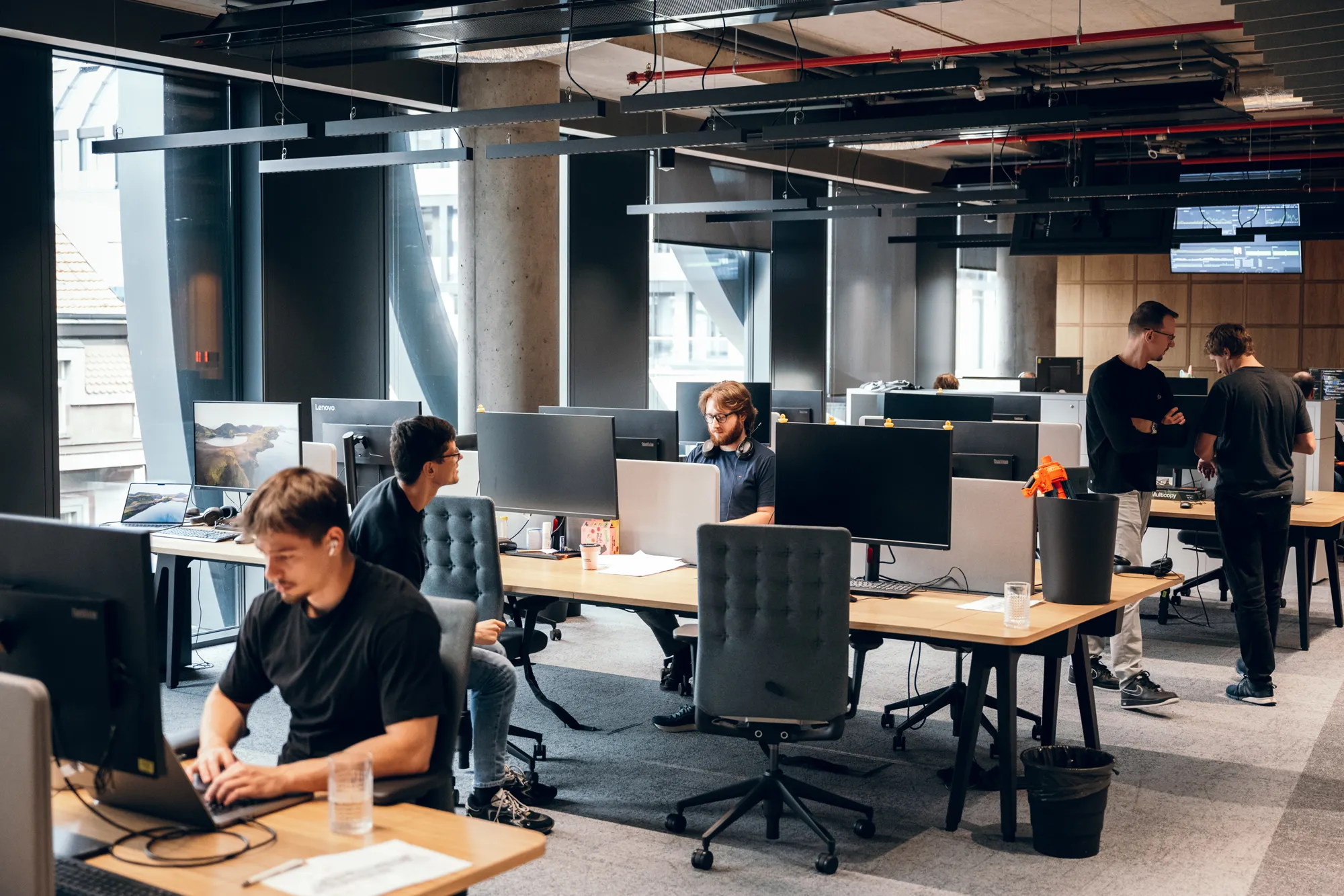 Team of people working in a modern open-office space