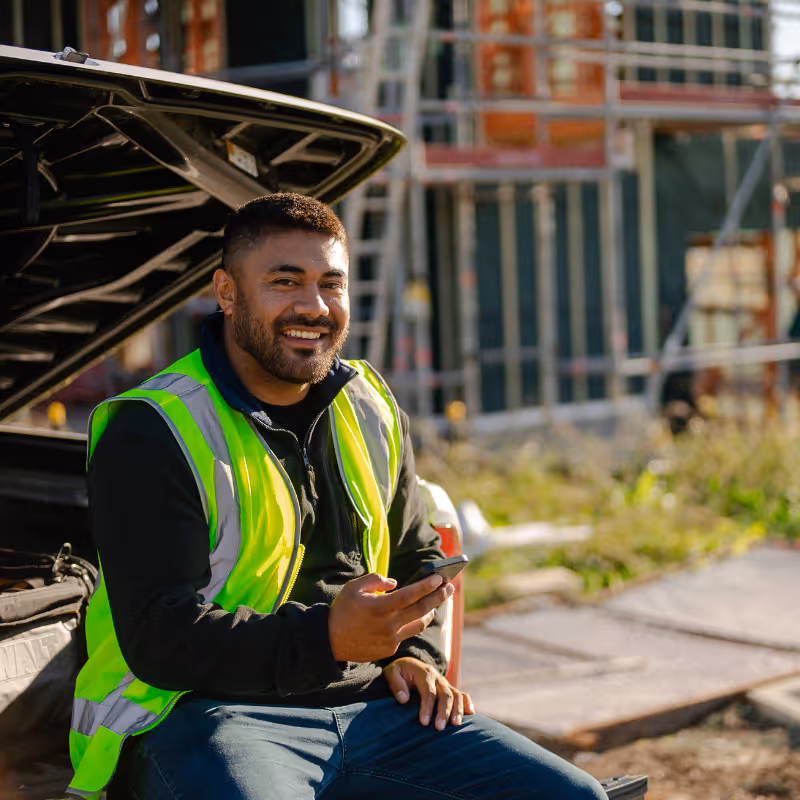 A photo of a man in a office sorting through papers