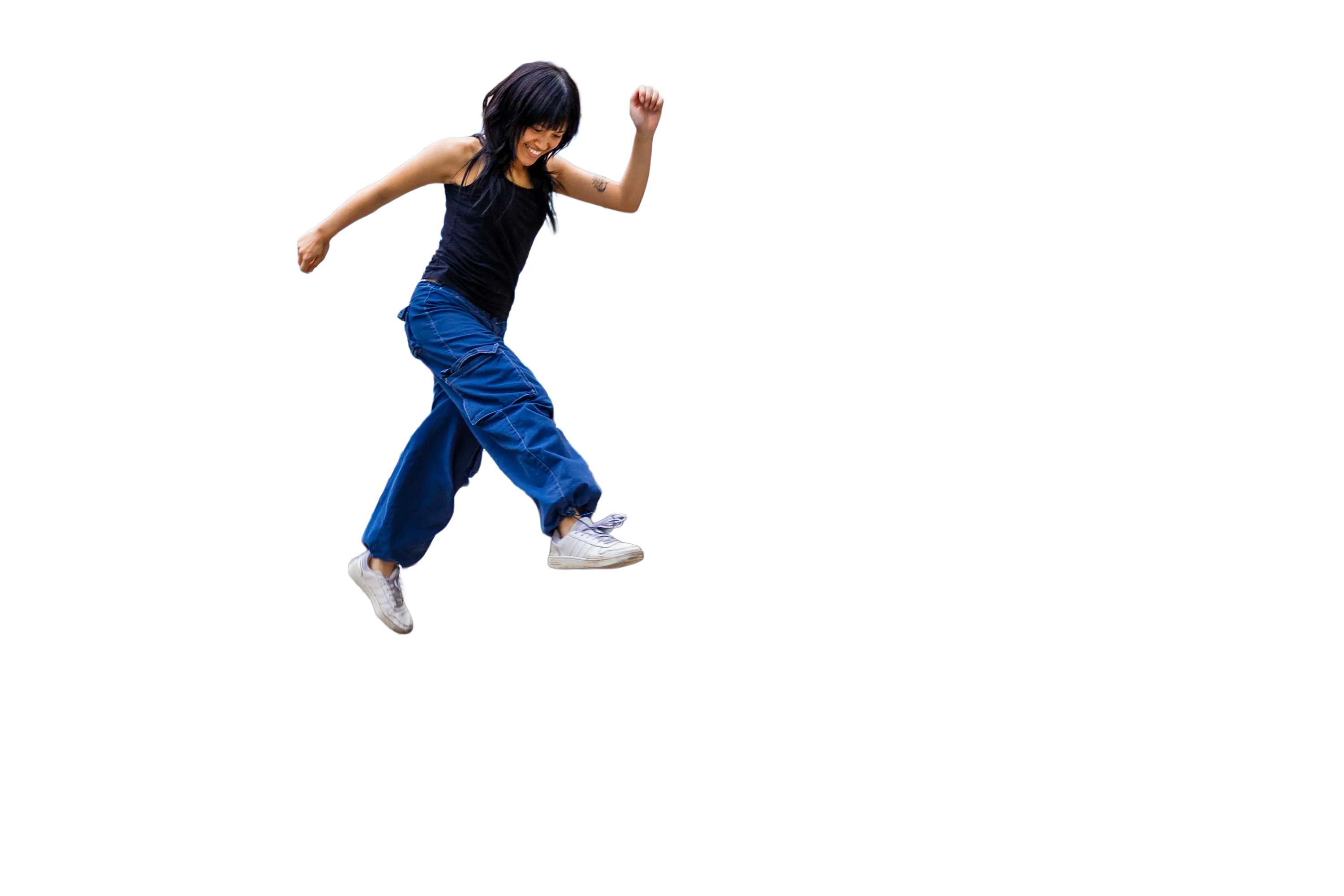 A girl jumping over street furniture